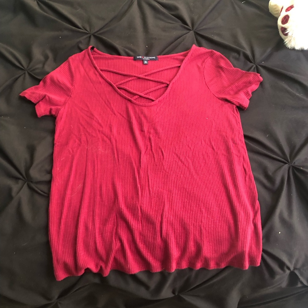 Cute top and is more of a maroon color then in the picture